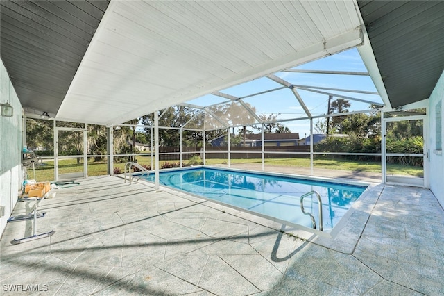 view of pool featuring a lanai and a patio area