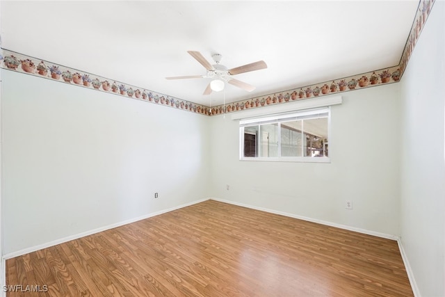 empty room featuring ceiling fan and wood-type flooring