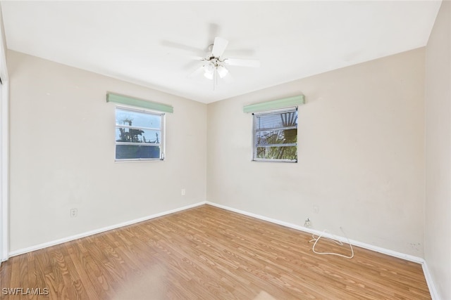 unfurnished room with ceiling fan and light hardwood / wood-style floors