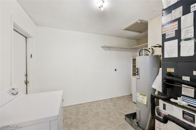 utility room featuring electric water heater and washer / clothes dryer