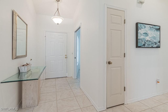 hallway with light tile patterned floors