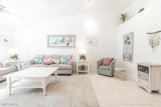 tiled living room with ceiling fan