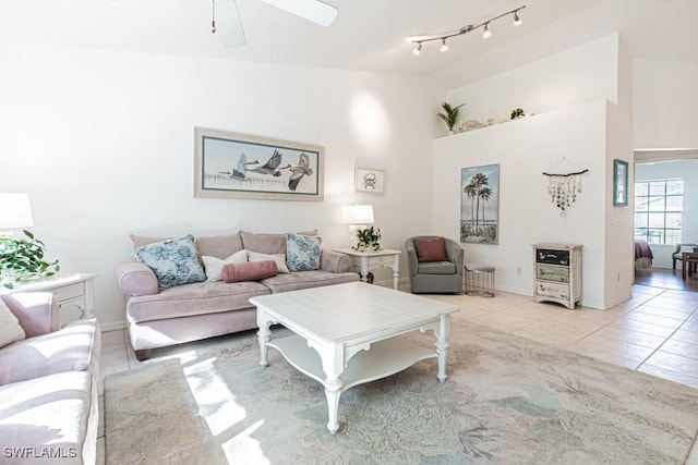 living room featuring light tile patterned flooring and ceiling fan