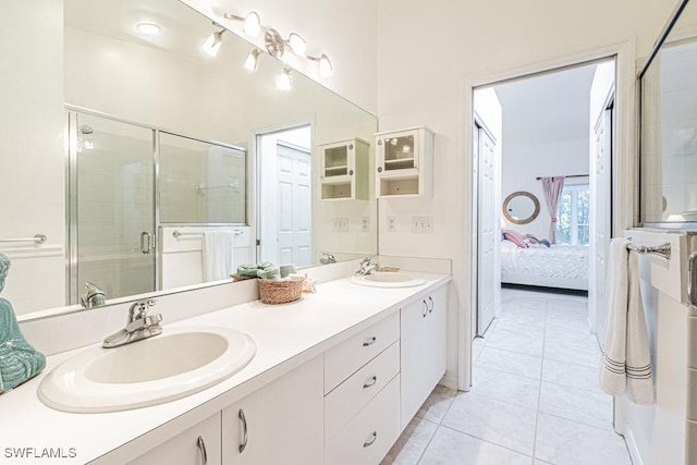 bathroom featuring vanity, walk in shower, and tile patterned floors