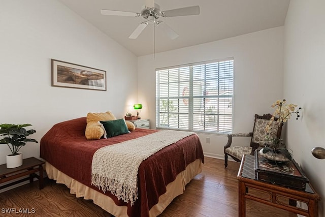 bedroom featuring ceiling fan, dark wood-type flooring, and lofted ceiling