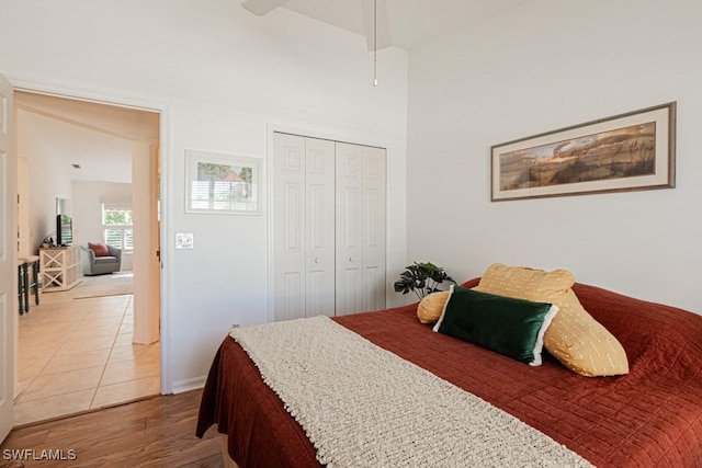 tiled bedroom with a closet