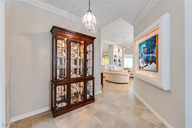 hall with crown molding and a chandelier