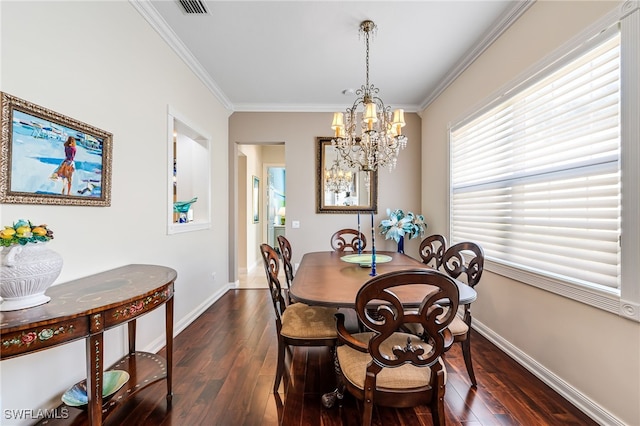 dining room with a notable chandelier, dark hardwood / wood-style flooring, and crown molding