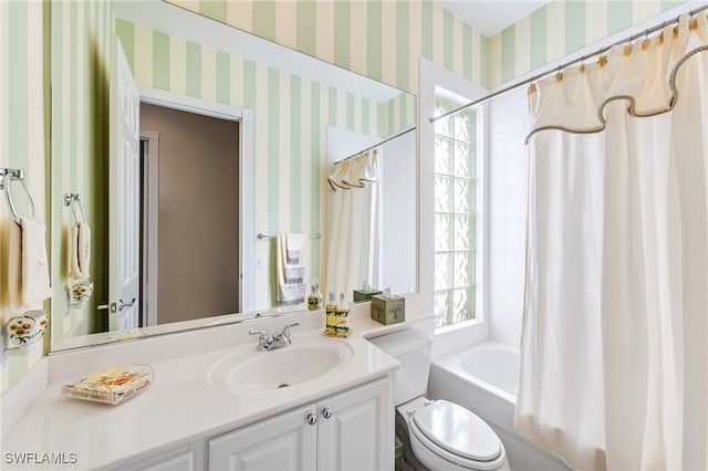 full bathroom with vanity, toilet, and shower / tub combo with curtain