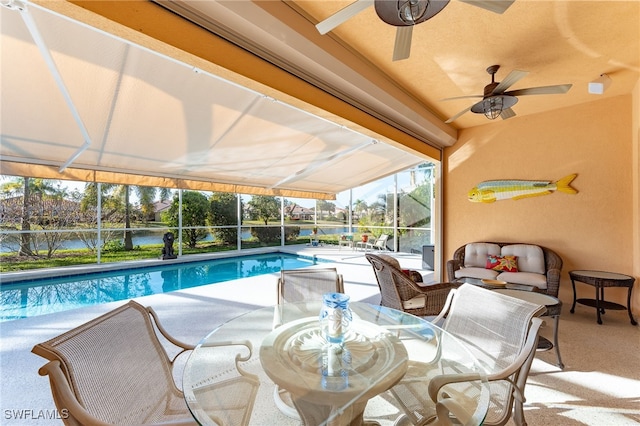 view of pool featuring glass enclosure and a patio area