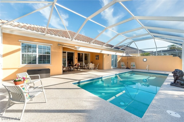 view of pool featuring a patio area and a lanai