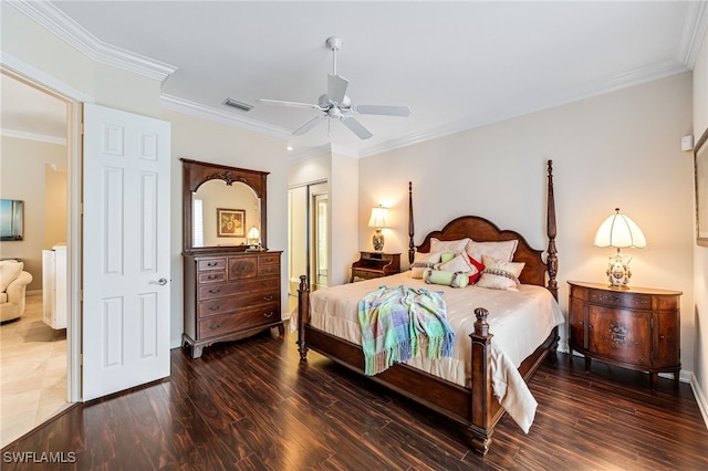 bedroom featuring ceiling fan, dark hardwood / wood-style flooring, ornamental molding, and a closet