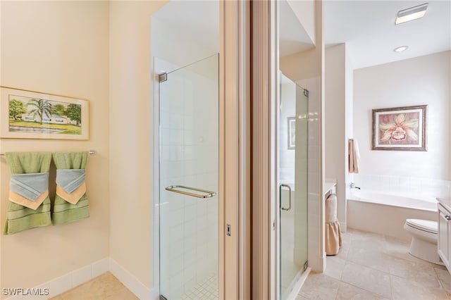 bathroom featuring tile patterned flooring, shower with separate bathtub, and vanity