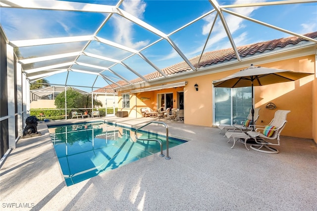 view of pool featuring a lanai and a patio area