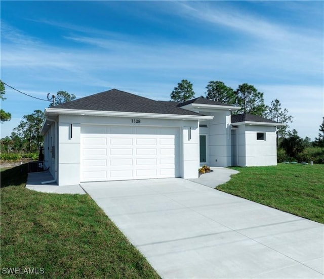 ranch-style house with a garage and a front yard