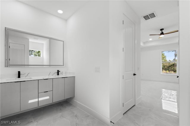 bathroom featuring ceiling fan and vanity