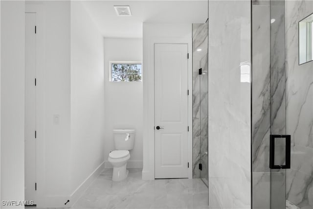 bathroom featuring toilet and an enclosed shower