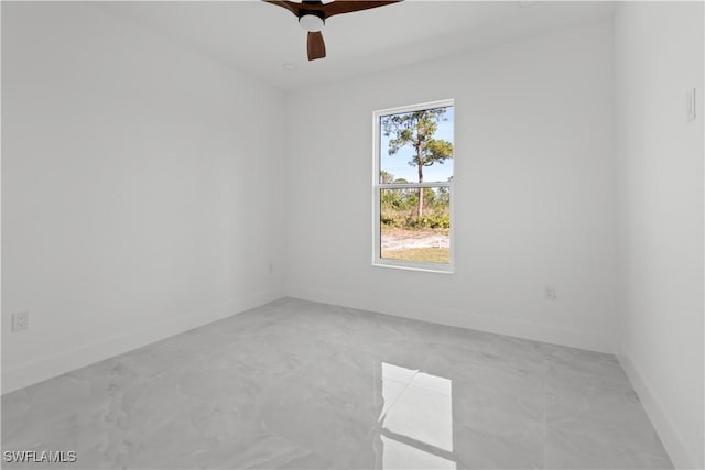 empty room featuring ceiling fan