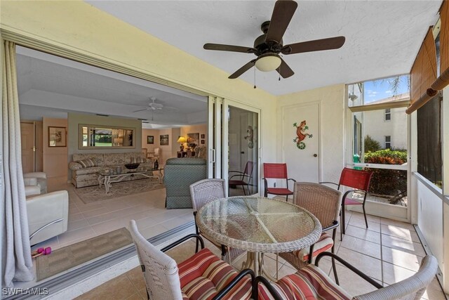 sunroom / solarium with ceiling fan