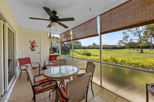 sunroom / solarium with ceiling fan