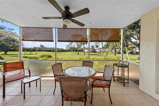 sunroom / solarium with ceiling fan