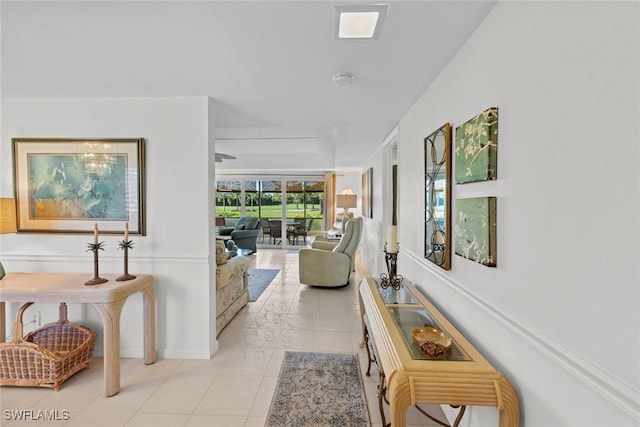 hall featuring light tile patterned floors