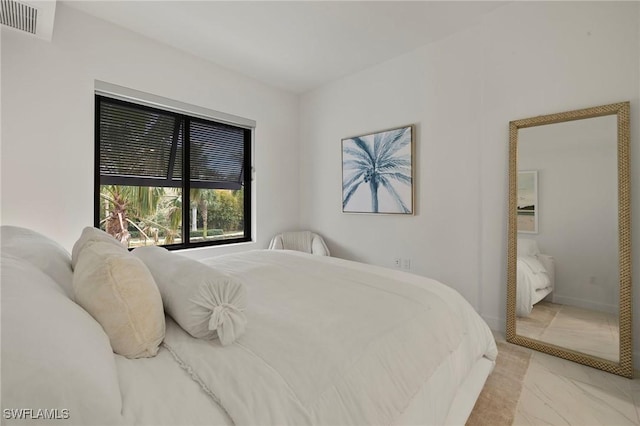 1125 Central Ave Unit 269, Naples, FL 34102 - bedroom featuring light marble finish flooring