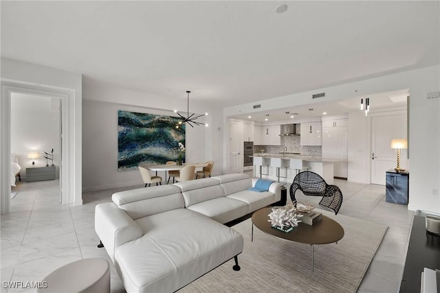 1125 Central Ave Unit 269, Naples, FL 34102 - living area with a chandelier