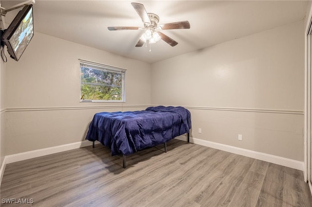 bedroom featuring light hardwood / wood-style flooring and ceiling fan