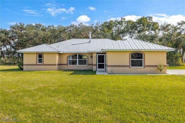 ranch-style home with a front lawn