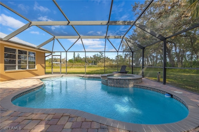 view of swimming pool featuring a lawn, a lanai, an in ground hot tub, and a patio