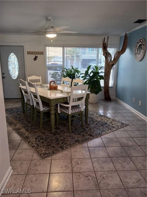 dining space featuring tile patterned floors and ceiling fan