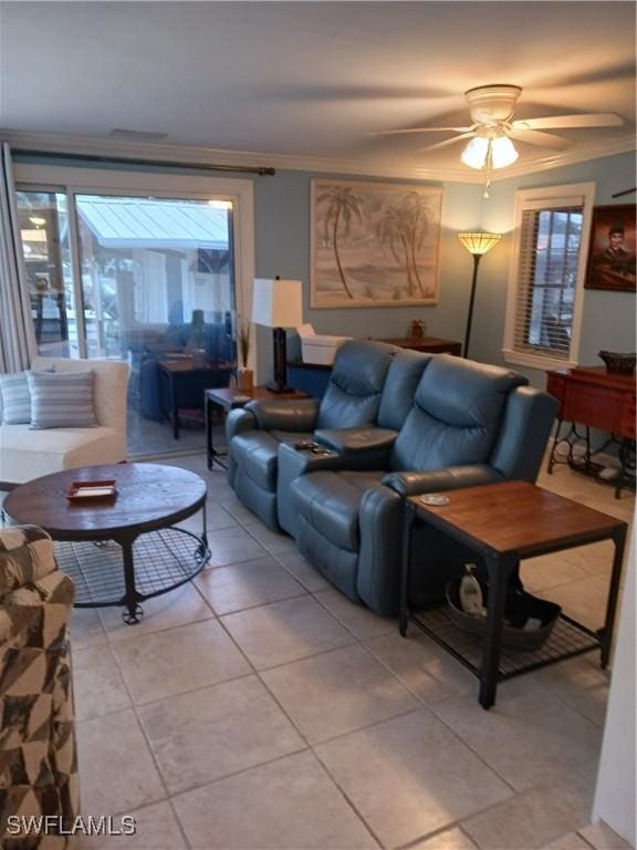 tiled living room featuring ceiling fan and ornamental molding