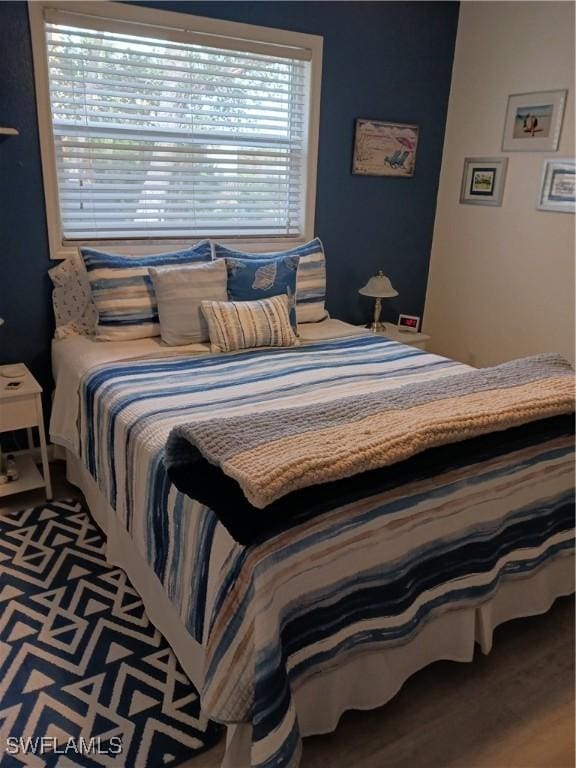 bedroom featuring hardwood / wood-style floors