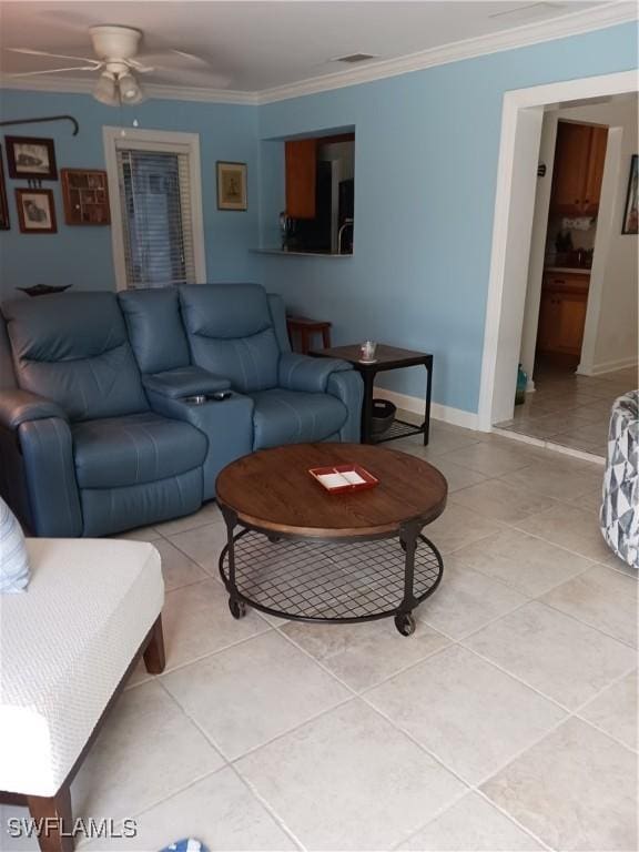 living room with ceiling fan, ornamental molding, and light tile patterned floors