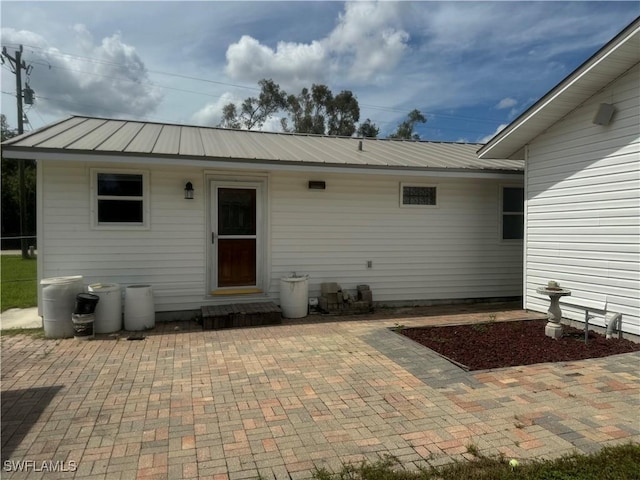 back of property with a patio area