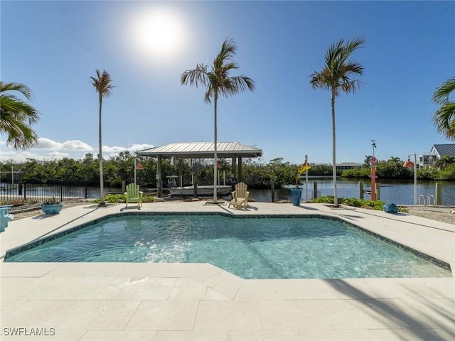 view of swimming pool featuring a gazebo, a water view, and a patio