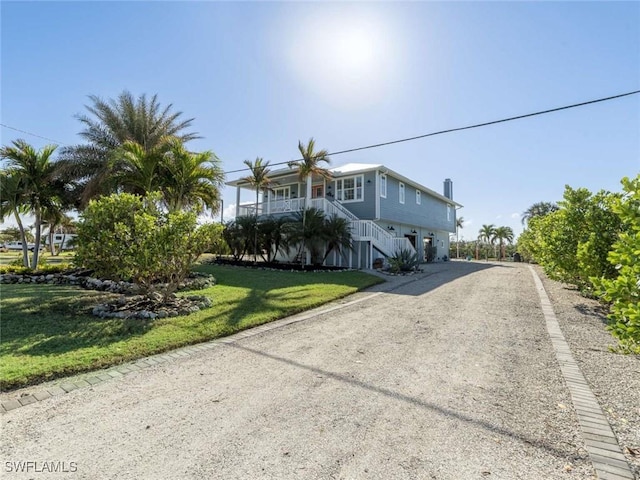 view of front of property with a front lawn and a porch