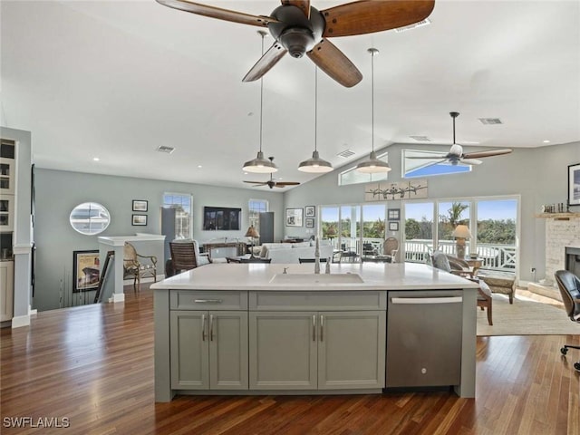 kitchen with gray cabinetry, ceiling fan, a healthy amount of sunlight, sink, and dishwasher