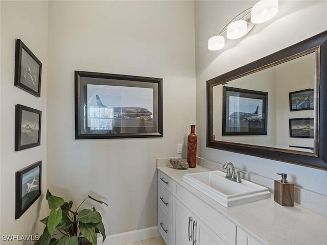 bathroom featuring tile patterned flooring and vanity