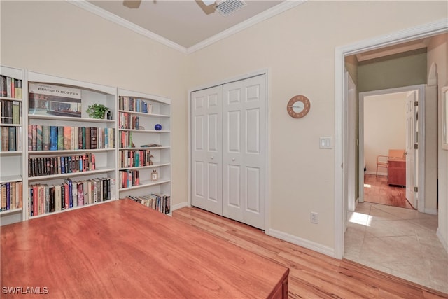 sitting room featuring ceiling fan, light tile patterned flooring, and ornamental molding