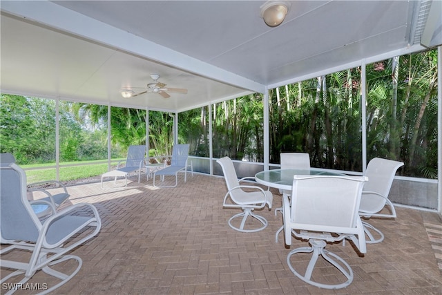 exterior space featuring beamed ceiling and ceiling fan