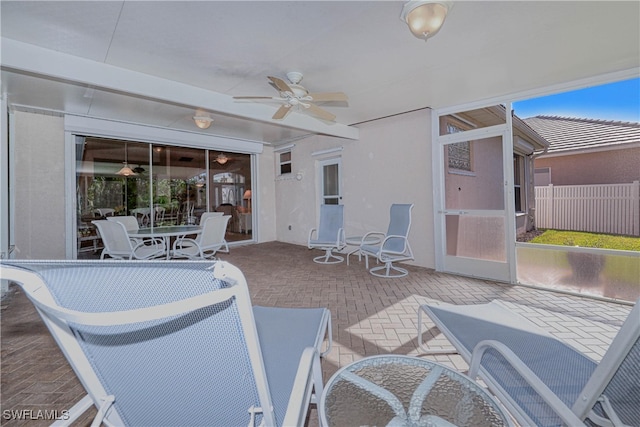 view of patio / terrace featuring ceiling fan