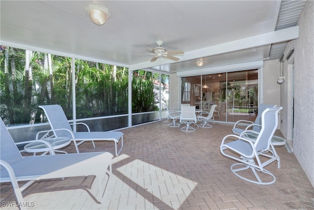 sunroom / solarium with ceiling fan