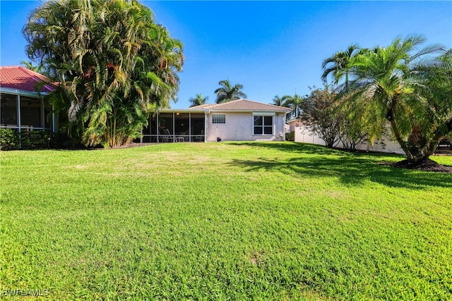 view of yard with a sunroom