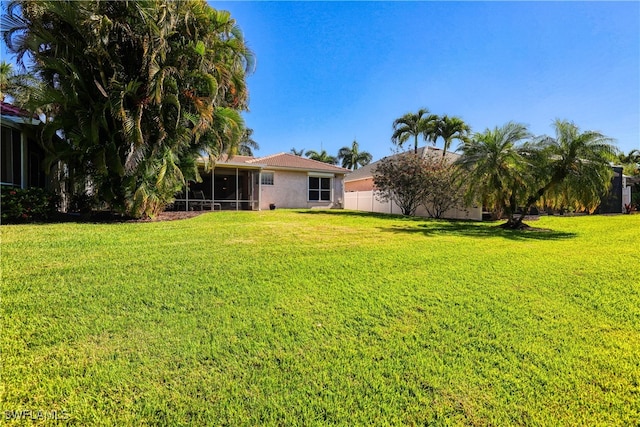 view of yard with a sunroom