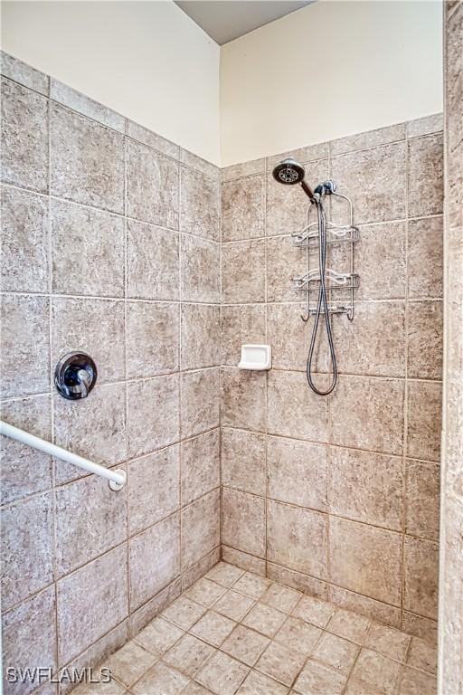 bathroom with a tile shower