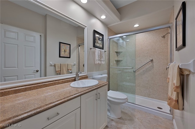 bathroom featuring tile patterned flooring, vanity, toilet, and a shower with door