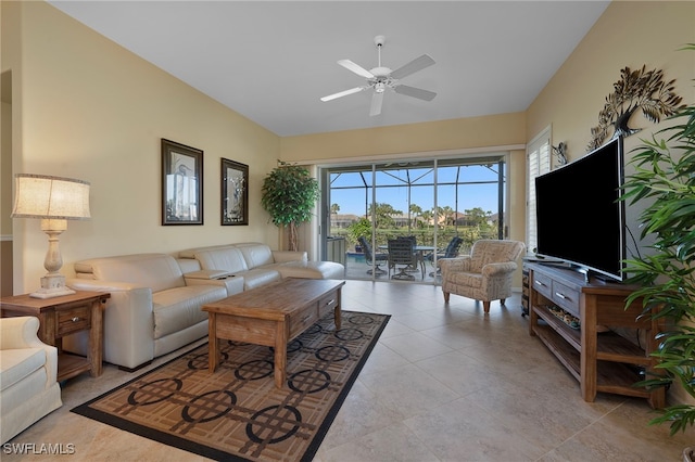 tiled living room with ceiling fan and a wealth of natural light