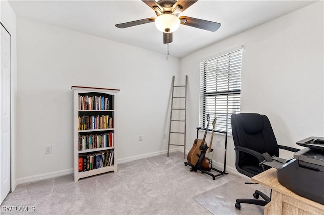 carpeted home office with ceiling fan